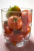 Different kinds of tomatoes in a glass bowl