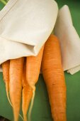 Fresh carrots on linen cloth