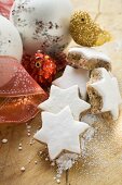 Cinnamon stars surrounded by Christmas decorations