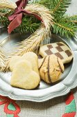 Assorted Christmas biscuits on pewter plate