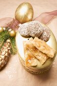 Assorted Christmas biscuits on biscuit tin