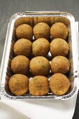 Falafel (chick-pea balls) in aluminium container