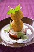 Falafel (chick-pea balls) with tomato and yoghurt sauce