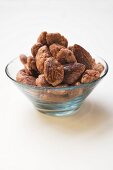Roasted almonds in glass bowl
