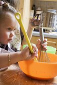 Two children baking