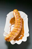 Currywurst (sausage with ketchup & curry powder) in paper dish