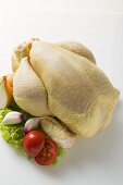 Fresh oven-ready chicken, garnished with vegetables