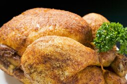 Spicy roast chicken, garnished with parsley