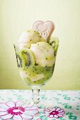 Ice cream sundae with vanilla ice cream and kiwi fruit