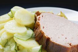Leberkäse (type of meatloaf) with potato salad (close-up)