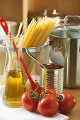 Spaghetti, tomatoes, oil and pan