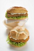 Two schnitzel rolls with remoulade and lettuce