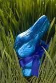 Blue chocolate Easter Bunny in grass