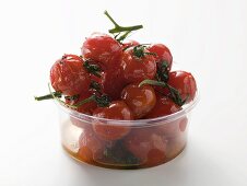 Roasted cherry tomatoes in plastic container