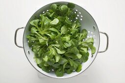 Corn salad in colander (overhead view)