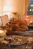 Stuffed turkey on table laid for Thanksgiving (USA)