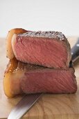 Beef steak with fatty edge, cut in two