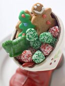 Christmas biscuits and sweets in chocolate boot