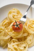 Tagliatelle with cherry tomato and fork