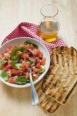 Tomato salsa with basil, grilled white bread, olive oil