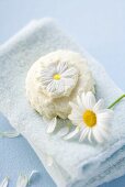 Marguerite soap and marguerite on towel