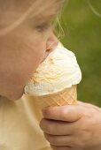 Small girl eating an ice cream cone