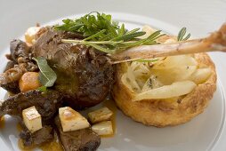 Braised goose leg with pear and onion tart