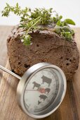 Roast beef with herbs, meat thermometer