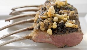 Rack of lamb with pesto crust and pine nuts