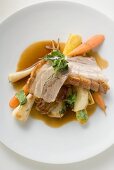 Roast belly pork with crackling and root vegetables