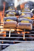 Sausage and pepper kebabs on barbecue