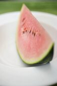 Wedge of watermelon on plate