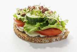 Wholemeal bread topped with tomato, cucumber, lettuce & sprouts