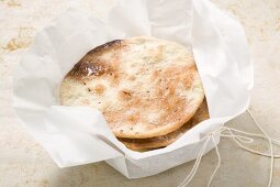 Caramelised aniseed biscuits in paper (Spain)