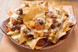 Tortilla chips with melted cheese, beans and mince