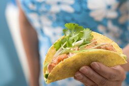 Woman holding taco