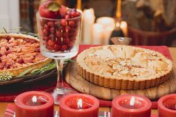 Two apple tarts on a Christmassy table