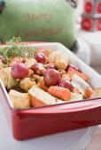 Roasted root vegetables in roasting dish (Christmas)