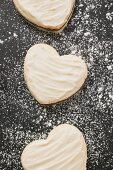 Three heart-shaped Christmas biscuits (overhead view)