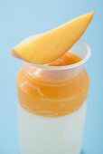 Mango yoghurt with wedge of mango