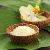 Bath salts and orchids in wooden bowls