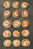 Blinis with sour cream and caviar (overhead view)