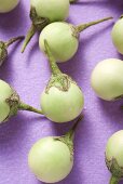 Several green mini-aubergines (detail)