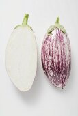 Two aubergine halves side by side