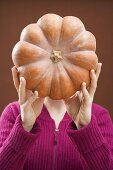 Woman holding pumpkin