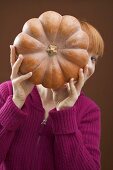 Woman holding pumpkin