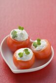 Tomatoes with soft cheese stuffing in heart-shaped dish