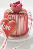 Marzipan-covered cake & heart-shaped biscuit (Valentine's Day)