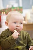 Baby eating chocolate Christmas tree