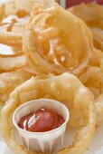 Deep-fried onion rings with ketchup